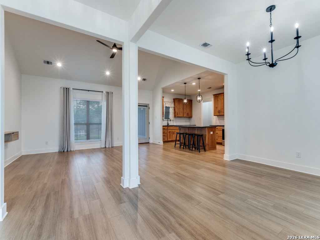 1015 Timbercrest Pleasanton, TX 78064 - Photo 6 of 26 a large hall with wooden floor and a large mirror