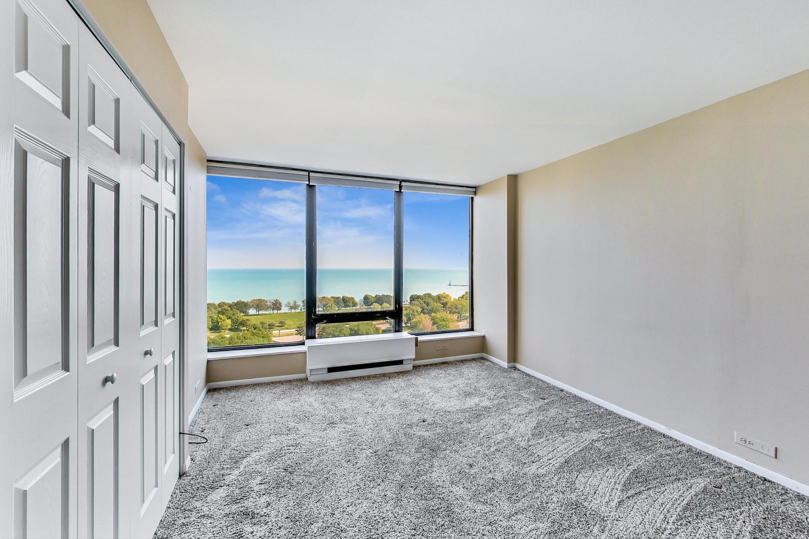 5445 North Sheridan Road, Unit 1706 Chicago, IL 60640 - Photo 11 of 26 a view of an empty room and window