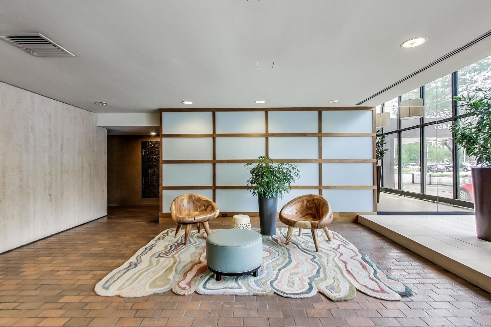 5445 North Sheridan Road, Unit 1706 Chicago, IL 60640 - Photo 19 of 26 a dining room with furniture and a potted plant