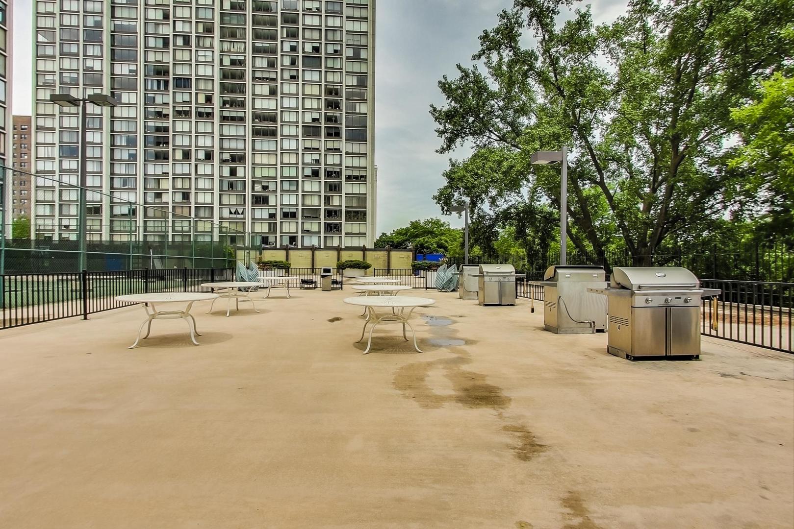 5445 North Sheridan Road, Unit 1706 Chicago, IL 60640 - Photo 21 of 26 a view of a swimming pool with a patio