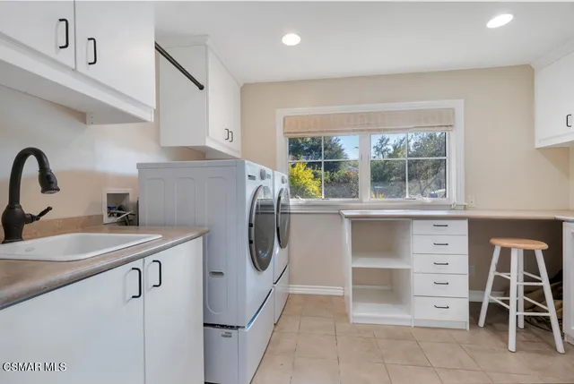 a view of a backyard with furniture and a fire pit