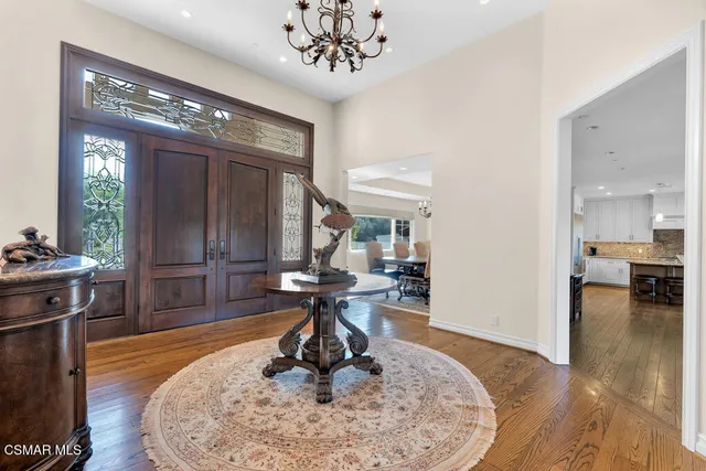 a living room with fireplace furniture and a flat screen tv
