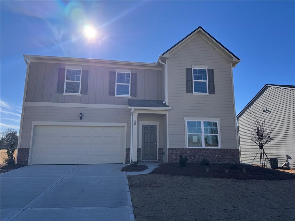 332 Corinth Drive Bethlehem, GA 30620 - Photo 1 of 1 a front view of a house with a yard and garage