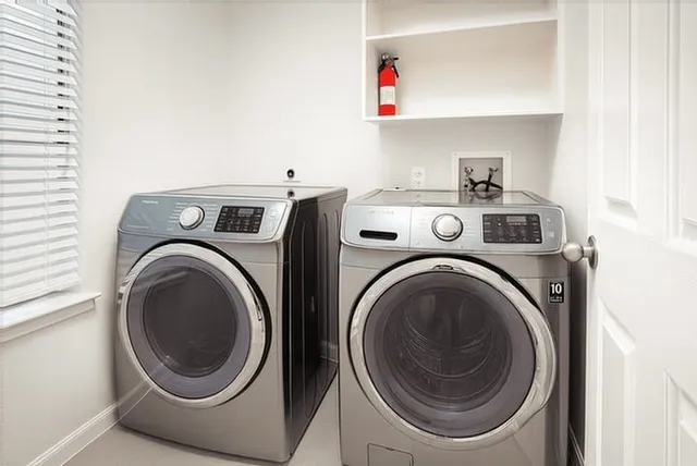 a utility room with dryer and washer