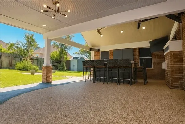 a view of a dinning table and chairs in the patio