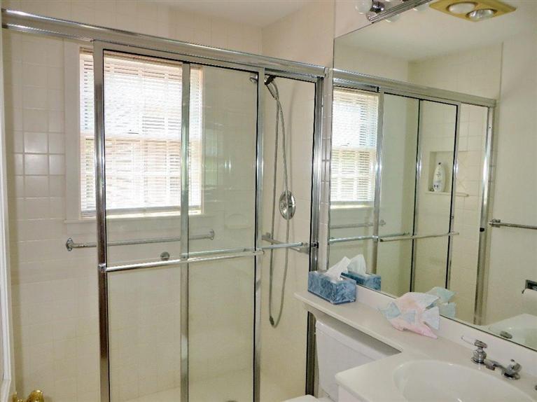 157 Lower County Road West Harwich, MA 02671 - Photo 11 of 14 a bathroom with a granite countertop sink a mirror and shower