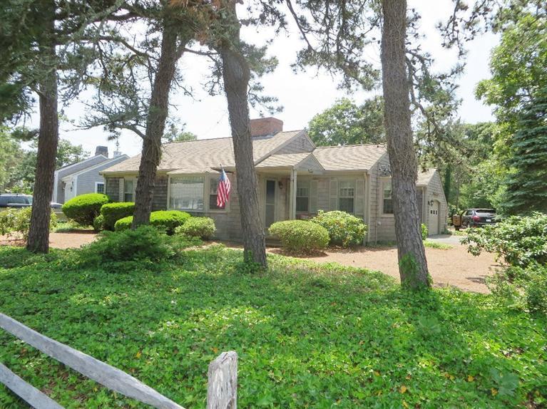 157 Lower County Road West Harwich, MA 02671 - Photo 12 of 14 a view of a house with a tree in a yard