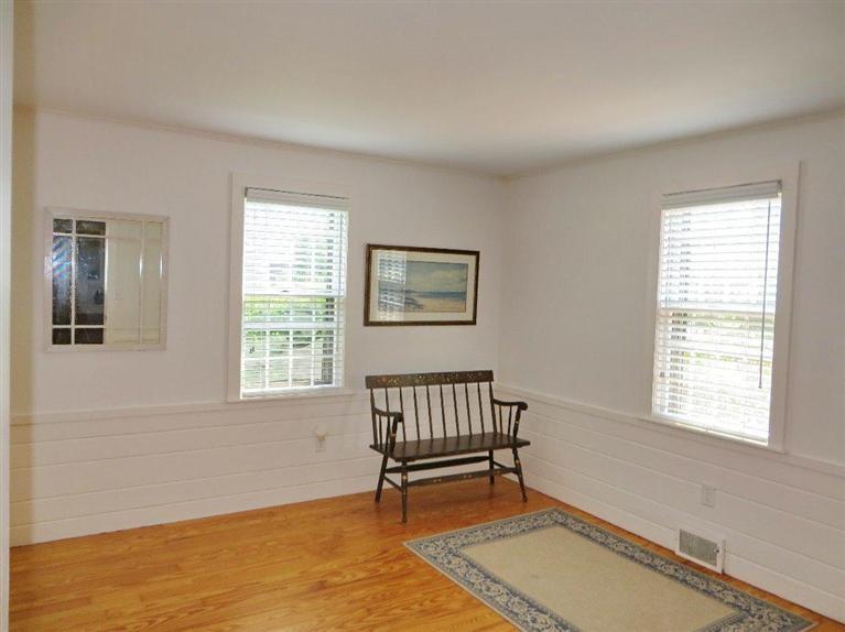 157 Lower County Road West Harwich, MA 02671 - Photo 8 of 14 a bench sitting in a room next to a window