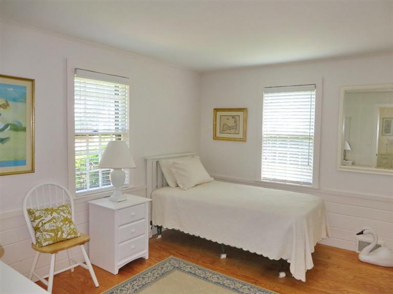 157 Lower County Road West Harwich, MA 02671 - Photo 9 of 14 a bedroom with a bed window and couch