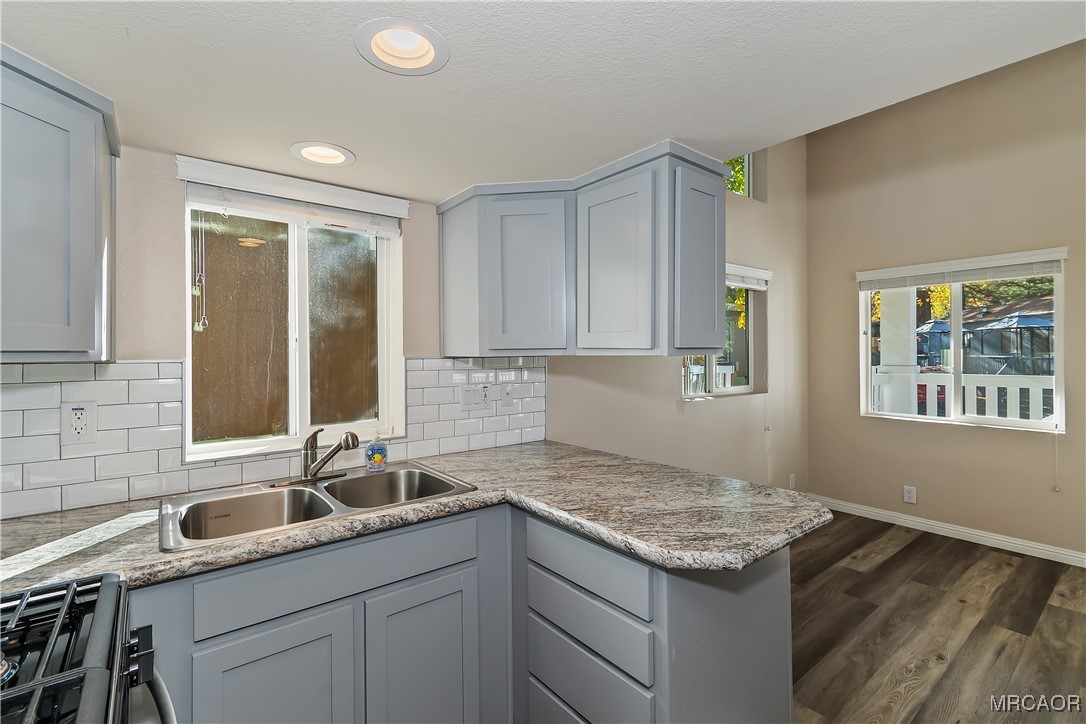 547 Alden Road, Unit RV5 Big Bear Lake, CA 92315 - Photo 12 of 34 a kitchen with a sink stove and cabinets