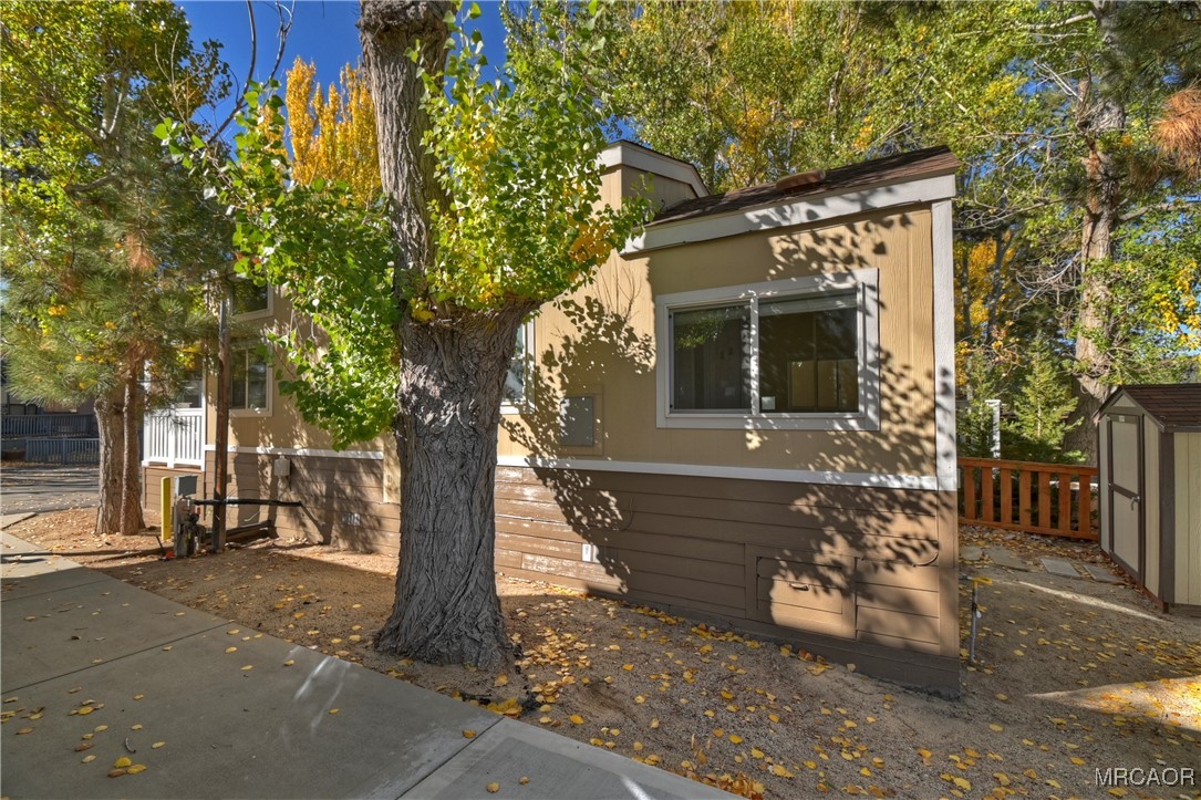 547 Alden Road, Unit RV5 Big Bear Lake, CA 92315 - Photo 29 of 34 a front view of a house with a tree