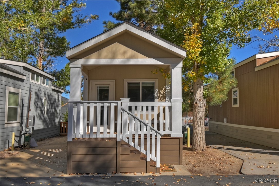 547 Alden Road, Unit RV5 Big Bear Lake, CA 92315 - Photo 32 of 34 a front view of a house with garden