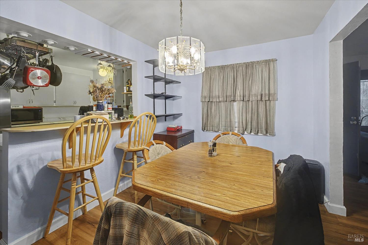 1763 E Street Napa, CA 94559 - Photo 10 of 31 a view of a dining room with furniture and chandelier