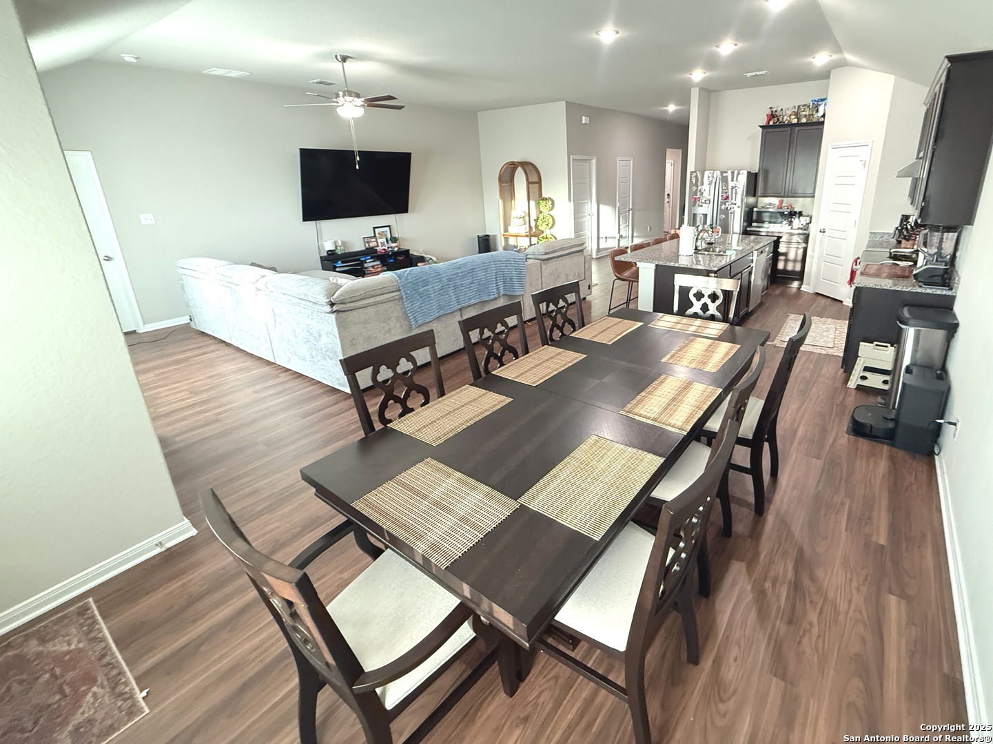 20929 Pleasanton Road San Antonio, TX 78264 - Photo 16 of 51 a living room with furniture a flat screen tv and kitchen view