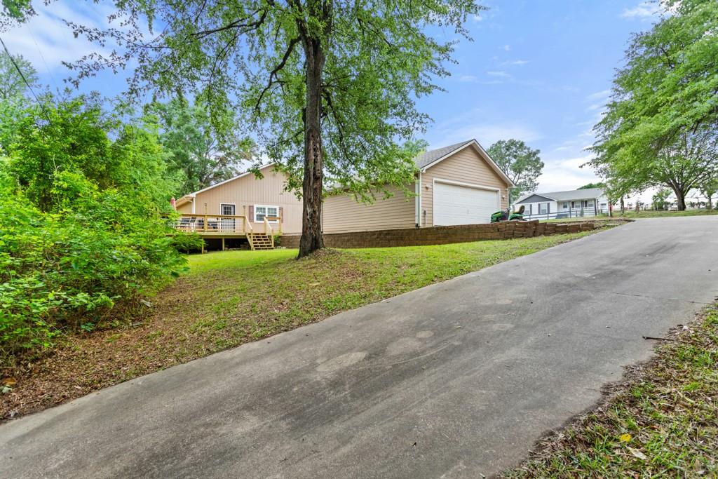 448 North Hill Road Tyler, TX 75706 - Photo 27 of 33 a front view of a house with a yard and garage