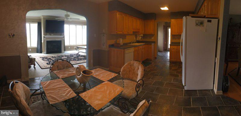 20256 Nanticoke Road Nanticoke, MD 21840 - Photo 13 of 26 a view of a dining room with furniture