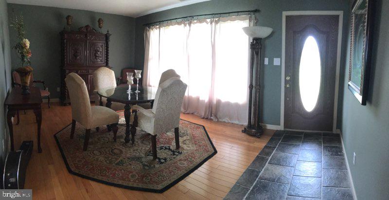 20256 Nanticoke Road Nanticoke, MD 21840 - Photo 14 of 26 a view of a livingroom with furniture and window
