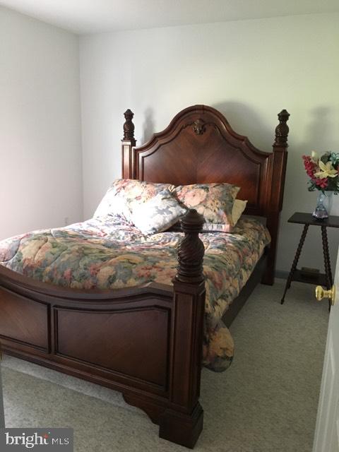 20256 Nanticoke Road Nanticoke, MD 21840 - Photo 16 of 26 a bed sitting in a bedroom next to a window