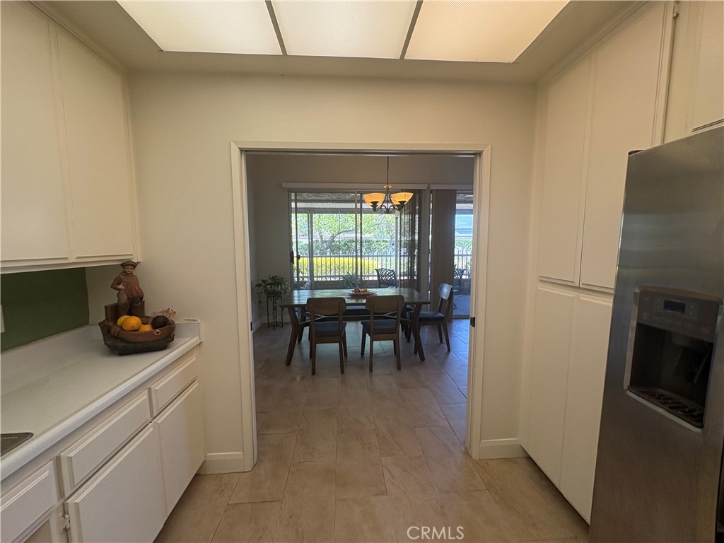 26168 Birkdale Road Menifee, CA 92586 - Photo 7 of 15 a kitchen with a stove and refrigerator