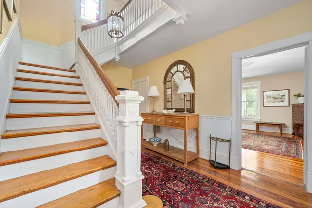 a living room with fireplace furniture and a flat screen tv