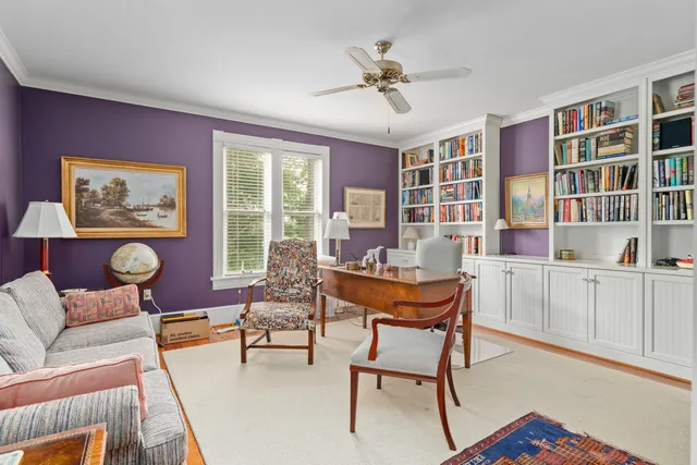 a bathroom with a sink toilet and window