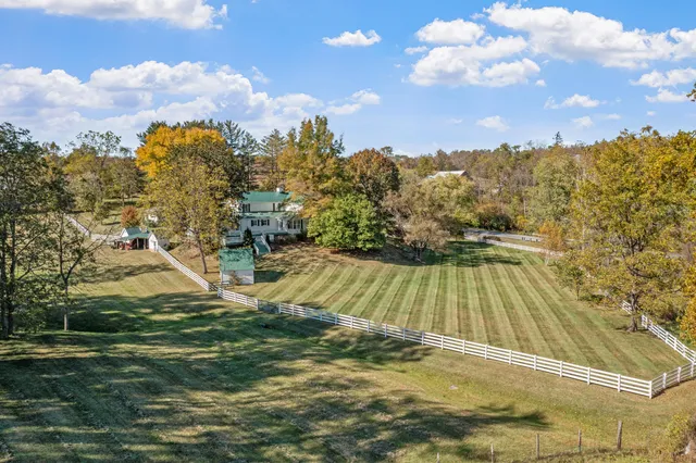 a kitchen with stainless steel appliances granite countertop a sink refrigerator and cabinets
