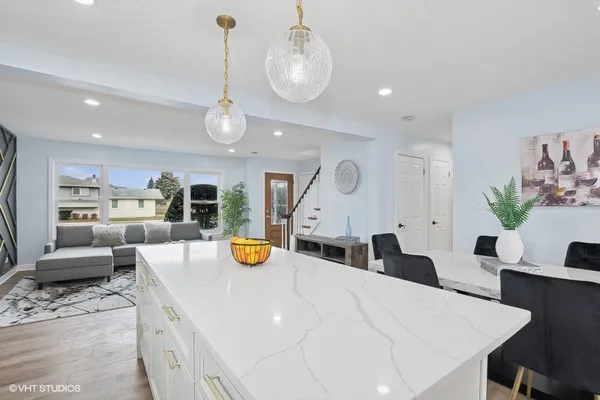 a kitchen with a table and chairs in it