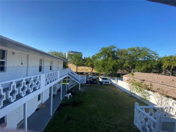 a view of house with outdoor space and swimming pool