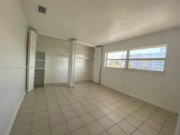 a view of an empty room and window