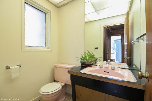 1655 Sunset Ridge Road Northbrook, IL 60062 - Photo 11 of 12 a bathroom with a sink a toilet and mirror