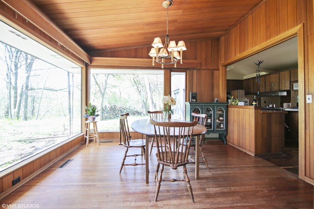 1655 Sunset Ridge Road Northbrook, IL 60062 - Photo 5 of 12 a view of a dining room with furniture a chandelier and wooden floor