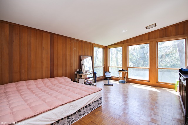 1655 Sunset Ridge Road Northbrook, IL 60062 - Photo 8 of 12 a bed room with a bed and large windows