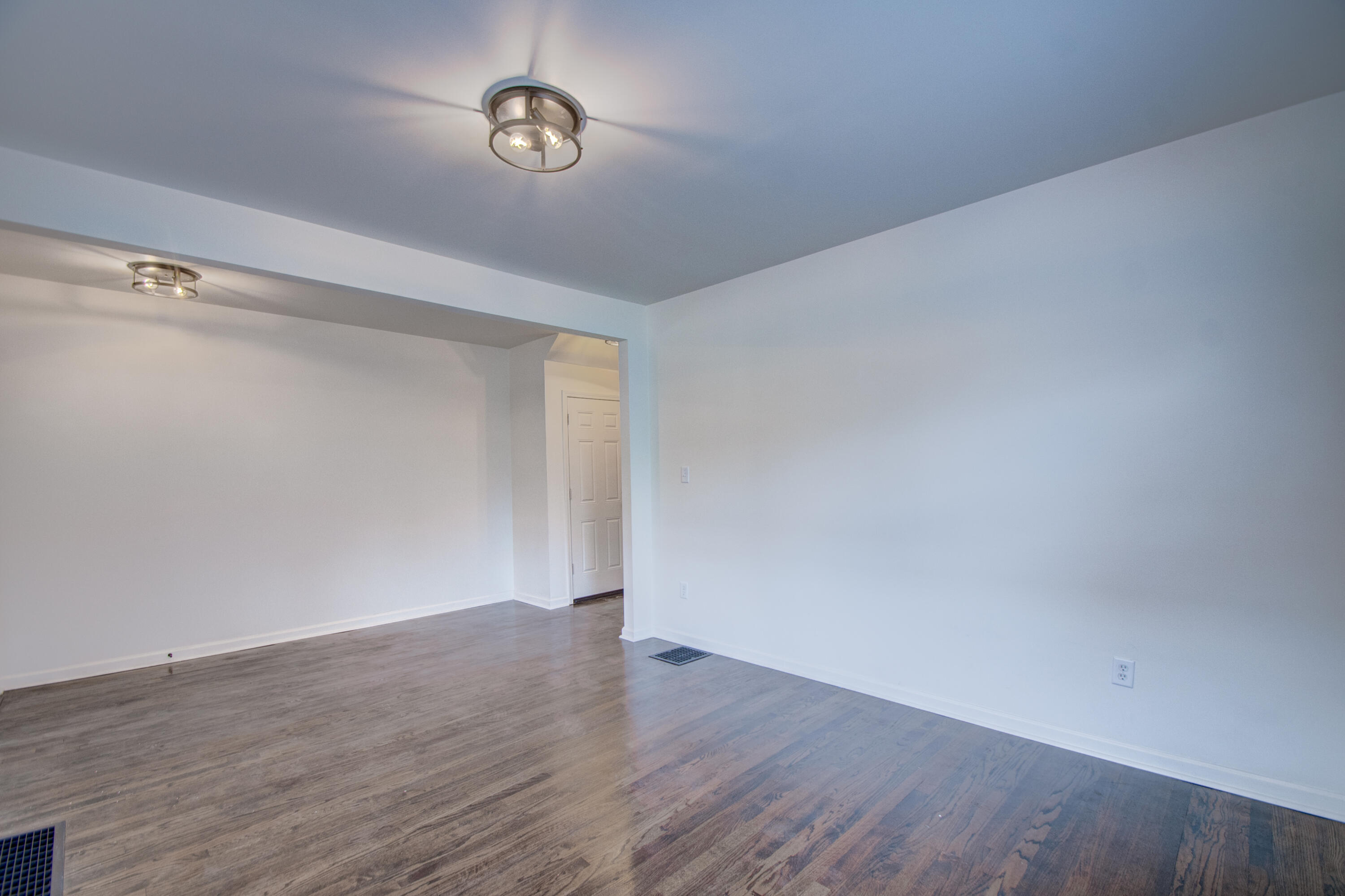 613 Tennessee Street Gary, IN 46402 - Photo 21 of 39 a view of an empty room with wooden floor