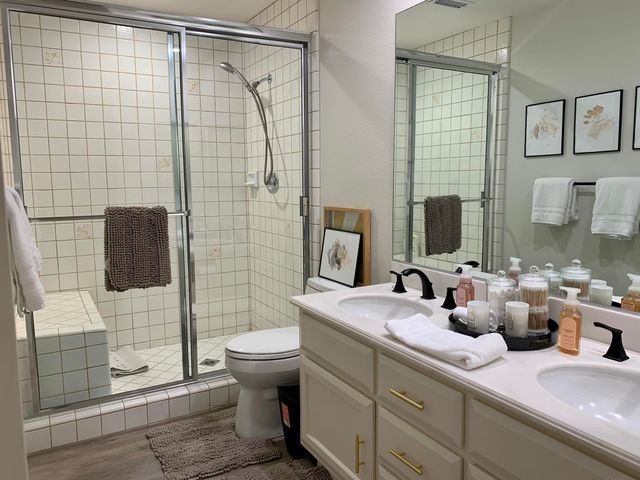 a bathroom with a sink toilet and shower
