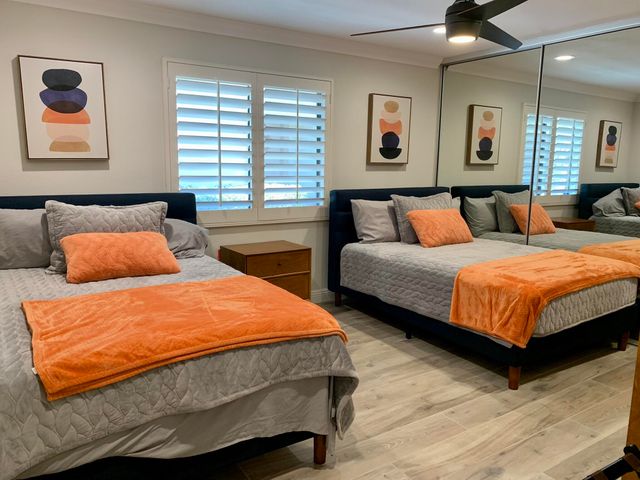 a bedroom with bed and window