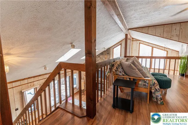 a view of balcony with wooden floor