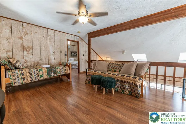 a view of livingroom with hardwood floor and furniture