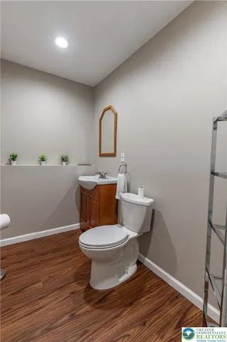 a view of a patio with dining table and chairs with plants and trees