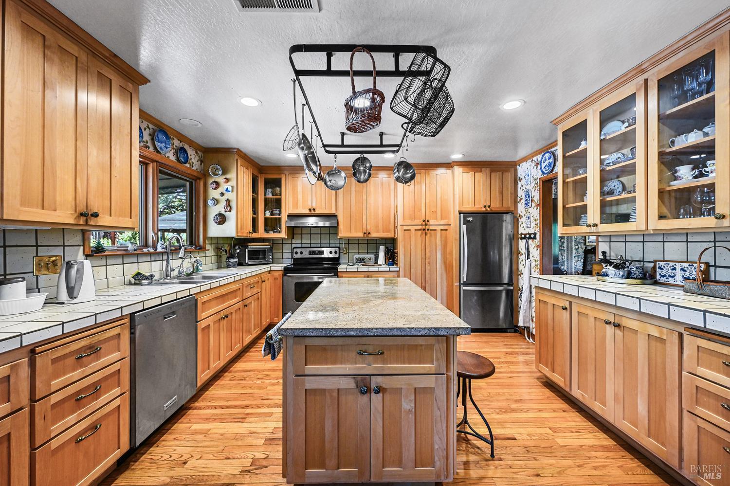 5143 Dry Creek Road Healdsburg, CA 95448 - Photo 48 of 85 a kitchen with stainless steel appliances granite countertop a sink stove and cabinets