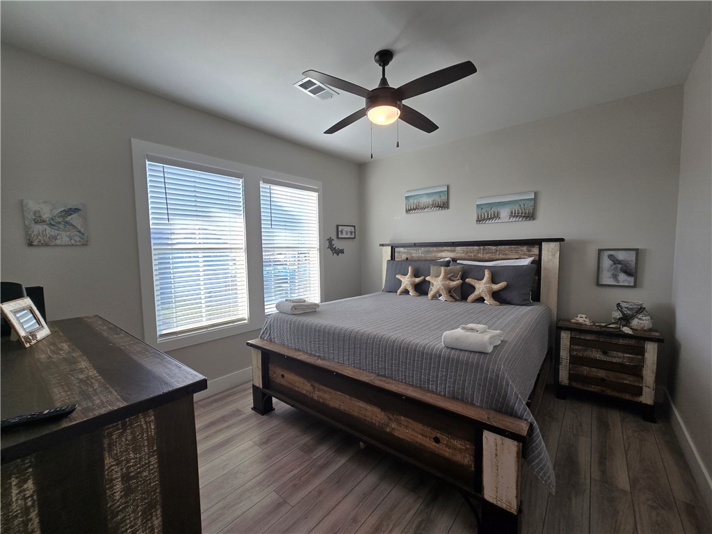 122 Ridge Harbor Drive Rockport, TX 78382 - Photo 21 of 34 a bedroom with a bed and a window