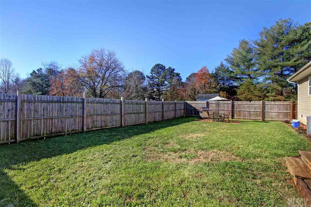 356 Kimmons Road Harmony, NC 28634 - Photo 14 of 25 a view of a backyard with wooden fence