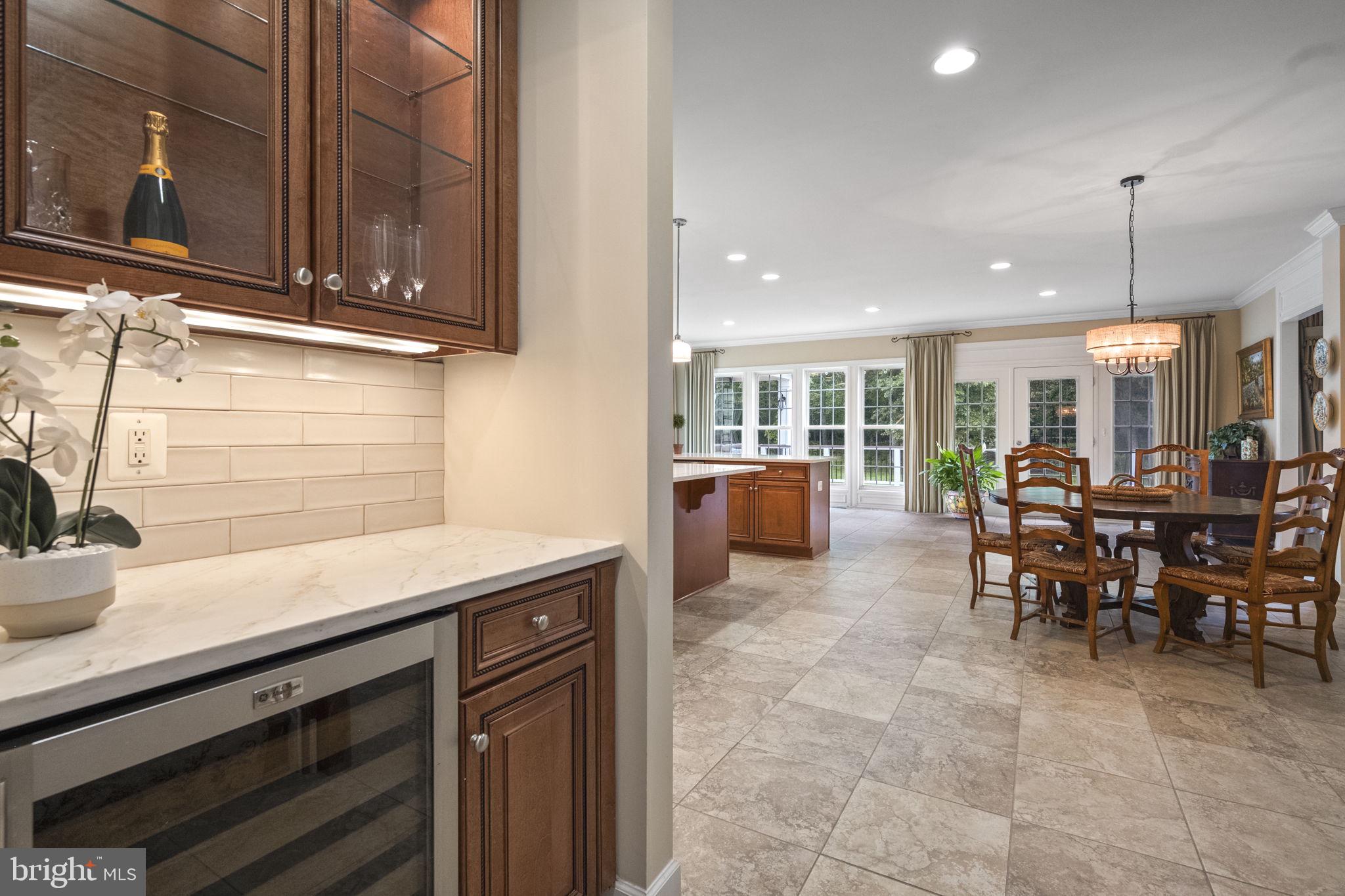 20899 McIntosh Place Leesburg, VA 20175 - Photo 14 of 69 a kitchen with stainless steel appliances granite countertop a sink and cabinets
