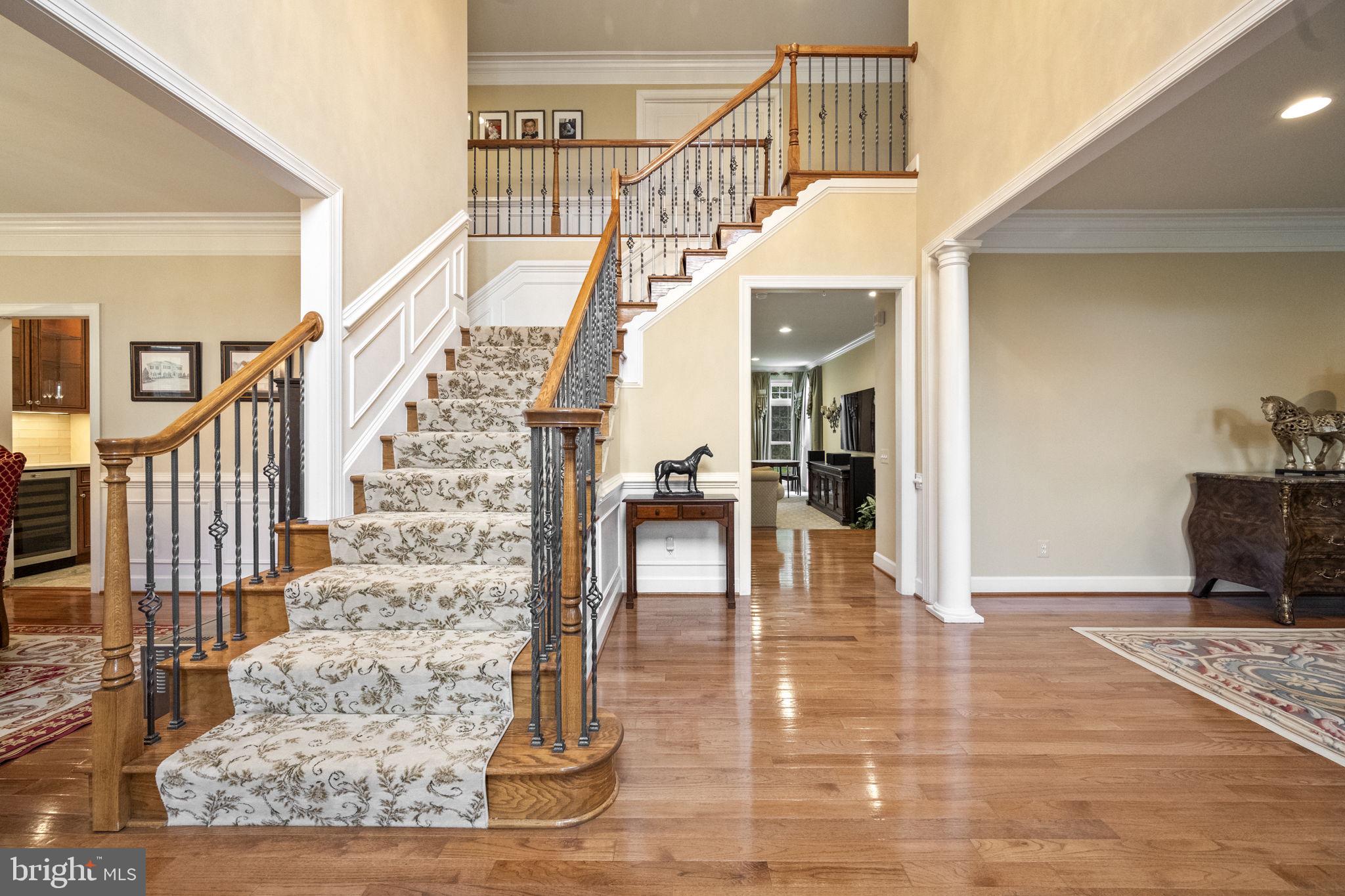 20899 McIntosh Place Leesburg, VA 20175 - Photo 18 of 69 a view of entryway and hall with wooden floor