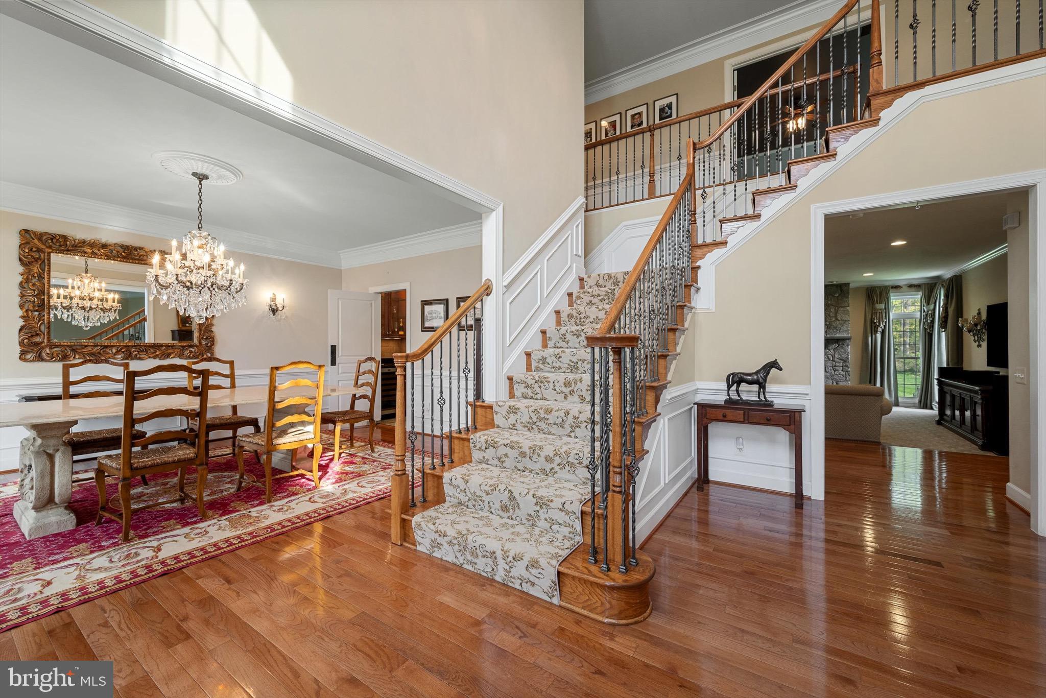 20899 McIntosh Place Leesburg, VA 20175 - Photo 19 of 69 a view of entryway dining room and hall with wooden floor