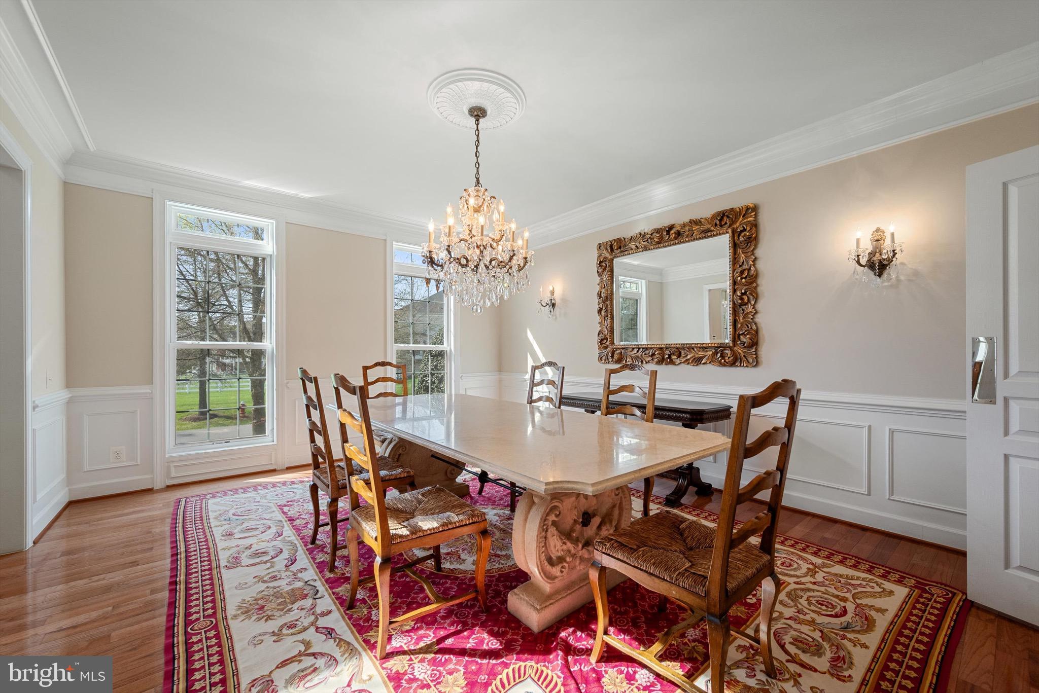 20899 McIntosh Place Leesburg, VA 20175 - Photo 21 of 69 a view of a dining room with furniture and wooden floor