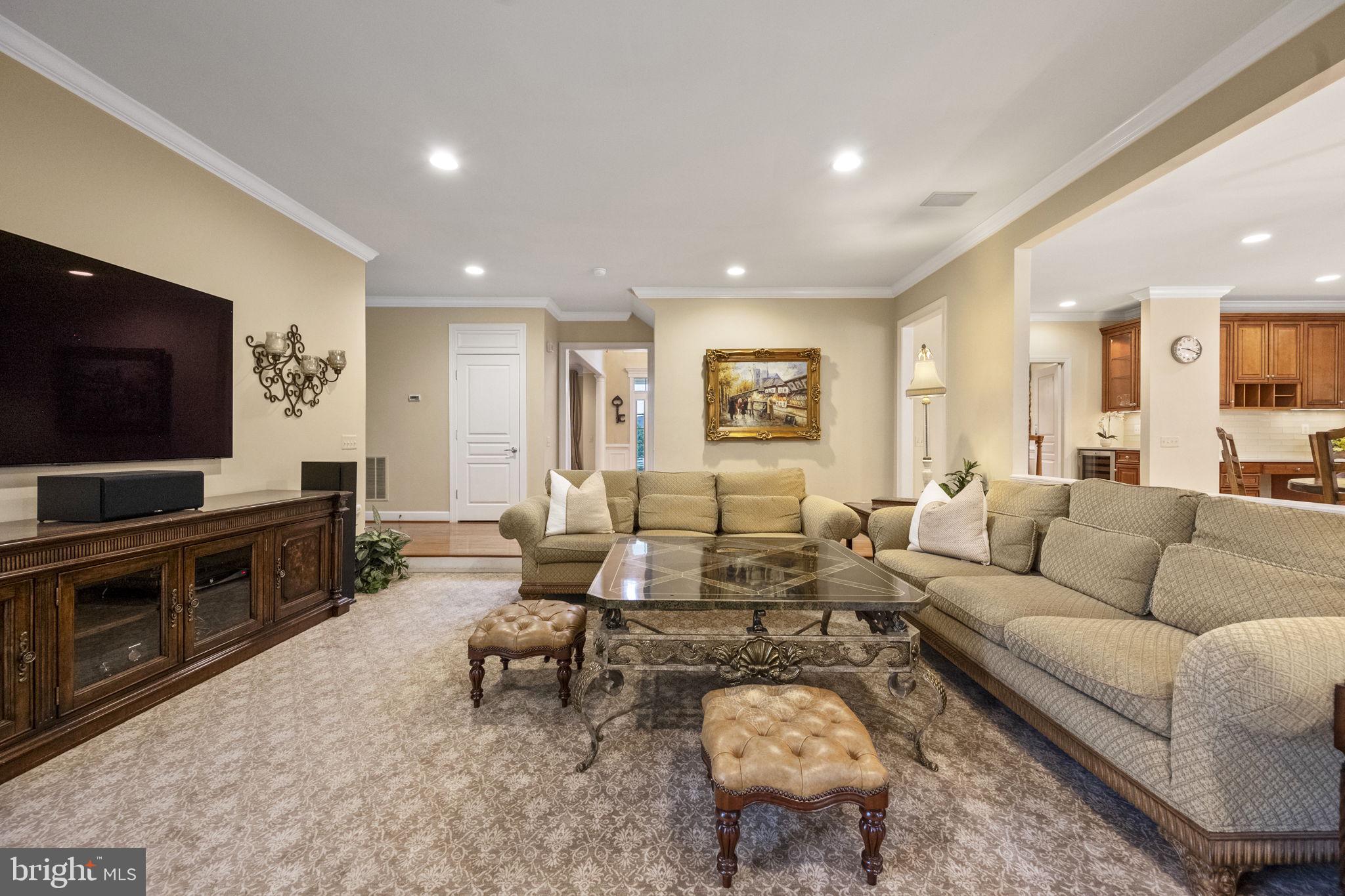 20899 McIntosh Place Leesburg, VA 20175 - Photo 24 of 69 a living room with furniture and a flat screen tv