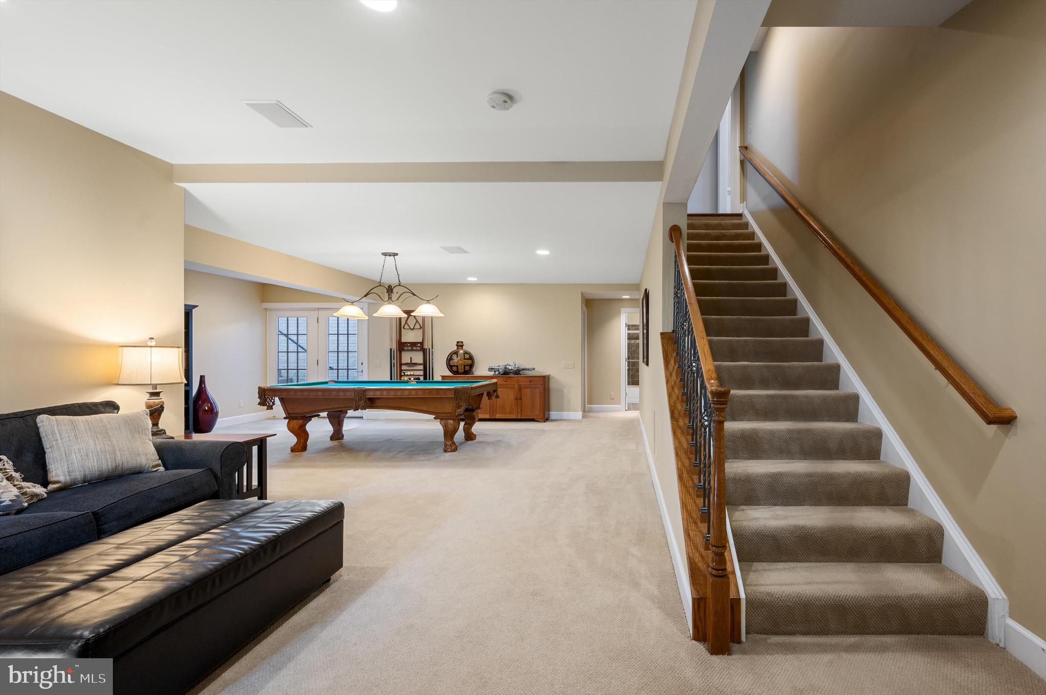 20899 McIntosh Place Leesburg, VA 20175 - Photo 34 of 69 a living room with furniture and a couches