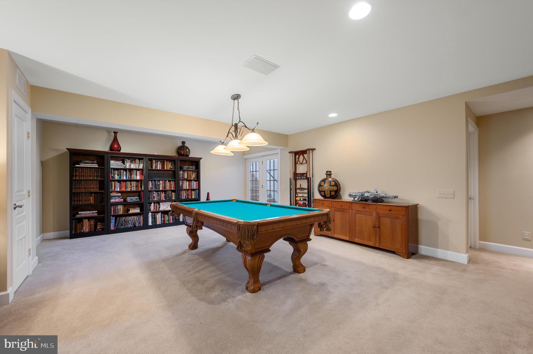 20899 McIntosh Place Leesburg, VA 20175 - Photo 35 of 69 a room with pool table and shelves