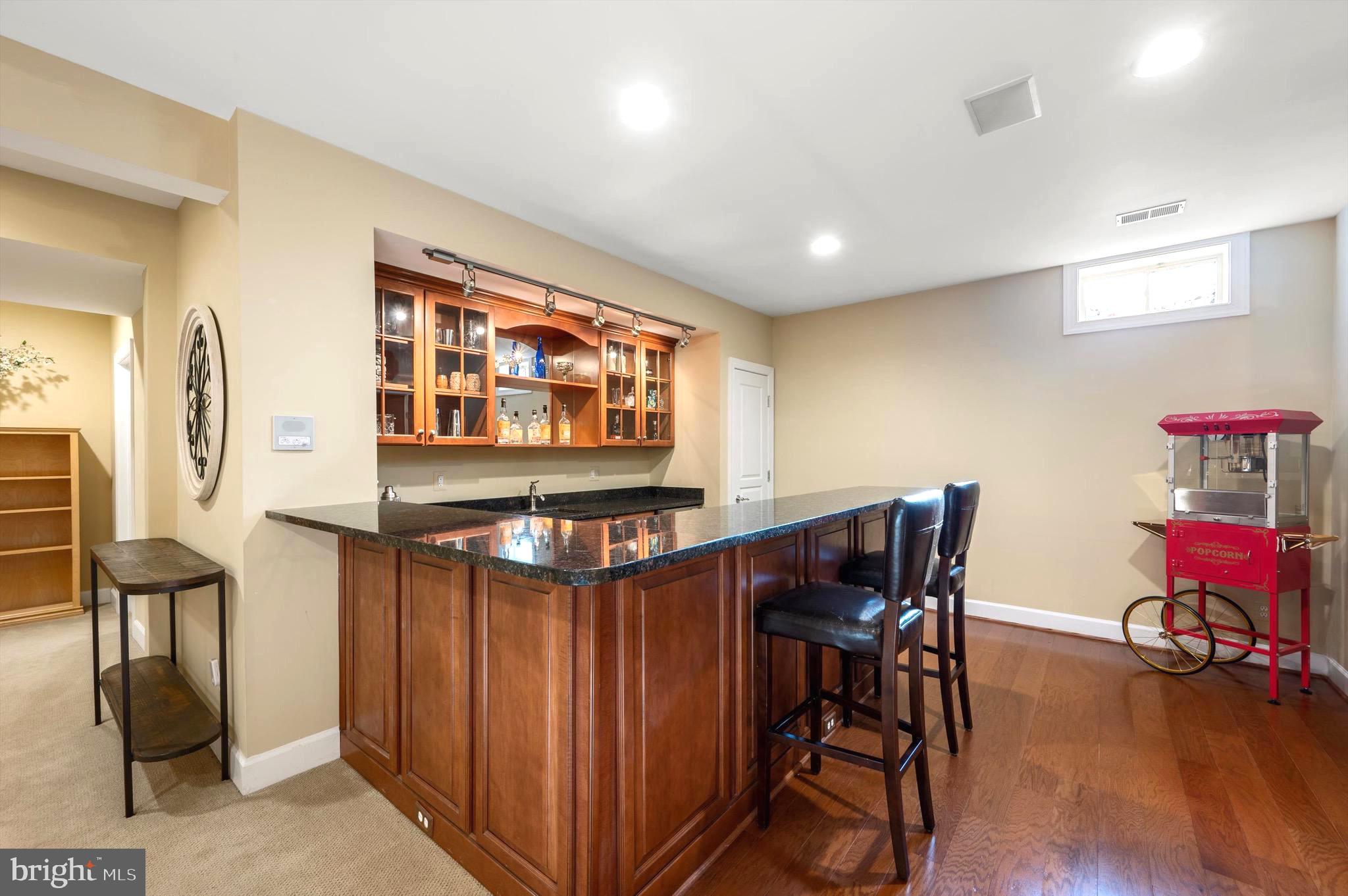 20899 McIntosh Place Leesburg, VA 20175 - Photo 36 of 69 a view of a dining room with furniture and wooden floor