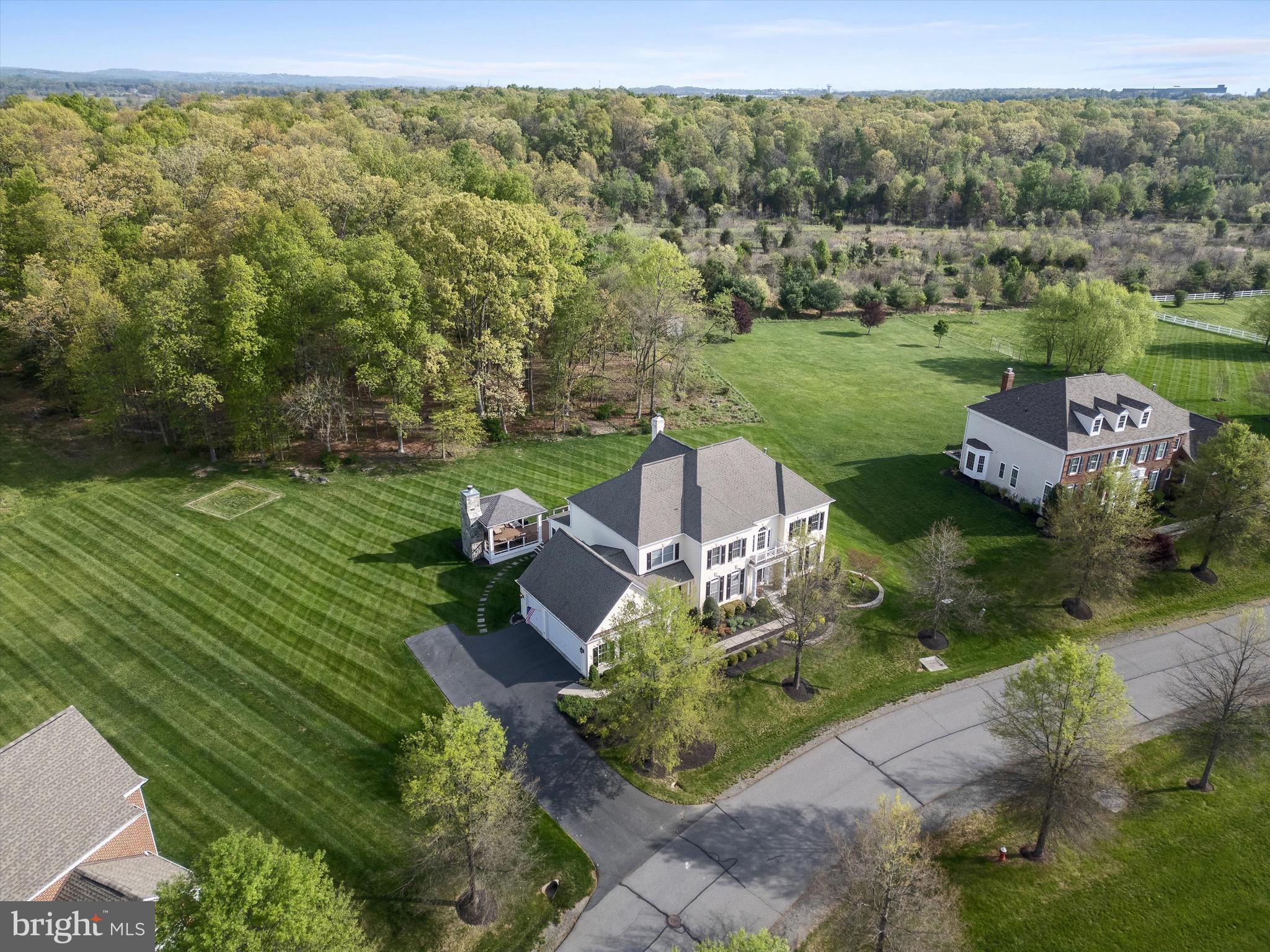 20899 McIntosh Place Leesburg, VA 20175 - Photo 4 of 69 an aerial view of a house with garden space and street view
